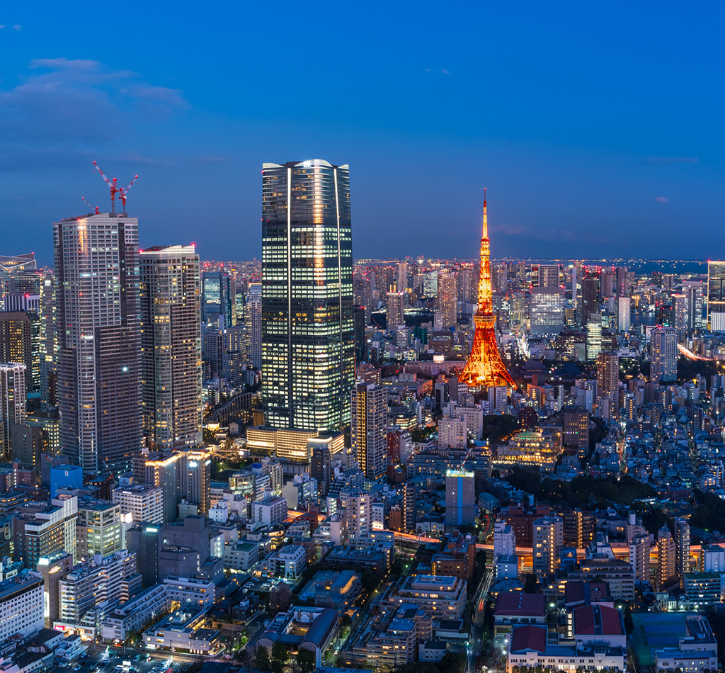 Tokyo central area city view with Azabudai Hills and Tokyo Tower at night.